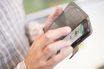 Person using mental health support app on a phone