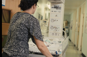 clinician pushing equipment