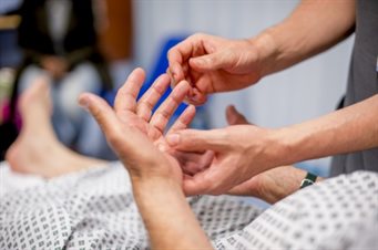 Patient and clinician hands
